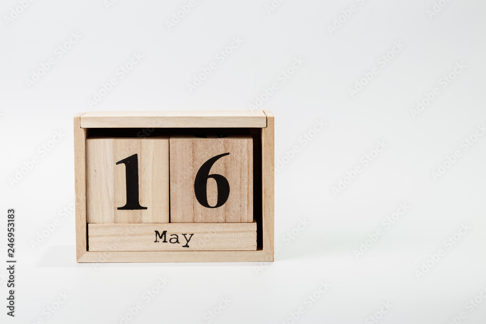 Wooden calendar May 16 on a white background Wooden calendar May 16 on a white background