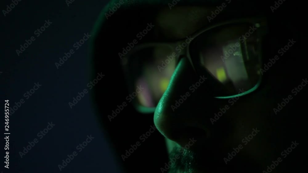 american man glasses hacker face in black background. male programmer professional adult cyber security in control room. concept global digital developer eyeglasses work online dark data technology american man glasses hacker face in black background. male programmer professional adult cyber security in control room. concept global digital developer eyeglasses work online dark data technology