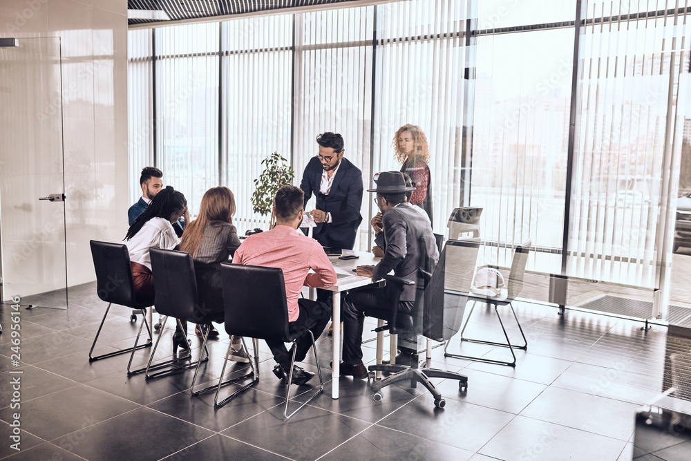 © alfa27 - Indian awesome man is showing his plan to collagues. successful buisnesman giving advice to new employees © alfa27 - Indian awesome man is showing his plan to collagues. successful buisnesman giving advice to new employees
