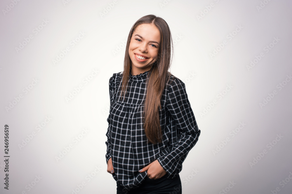 Close up young woman casual outfits standing and holds his hands in pockets Close up young woman casual outfits standing and holds his hands in pockets