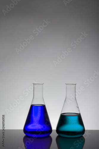 Liquid in laboratory bottles. Scientific biochemical laboratory. Colorful liquid.