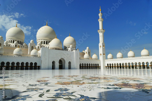 Sheikh Zayed Grand Mosque located in Abu Dhabi, white marble floor with blue sky, United Arab Emirates