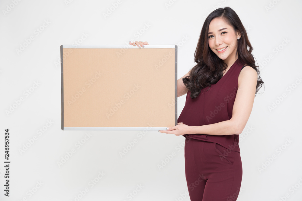 Beautiful Asian girl holding a blank poster for text or ad, Empty label for advertising or products picture Beautiful Asian girl holding a blank poster for text or ad, Empty label for advertising or products picture