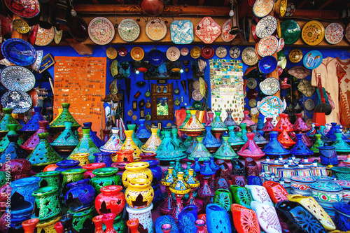 Colored Tajine, plates and pots out of clay on the market in Mor