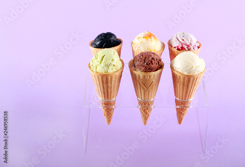 Assorted flavor ice cream in cones