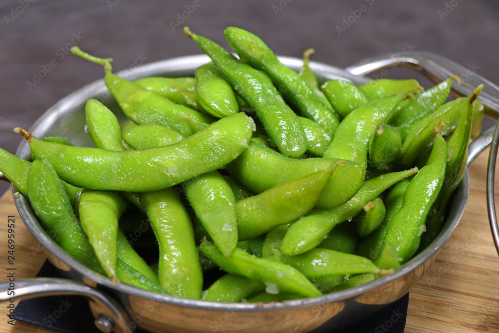 Boiled green soybeans in the pod ready for eating Boiled green soybeans in the pod ready for eating