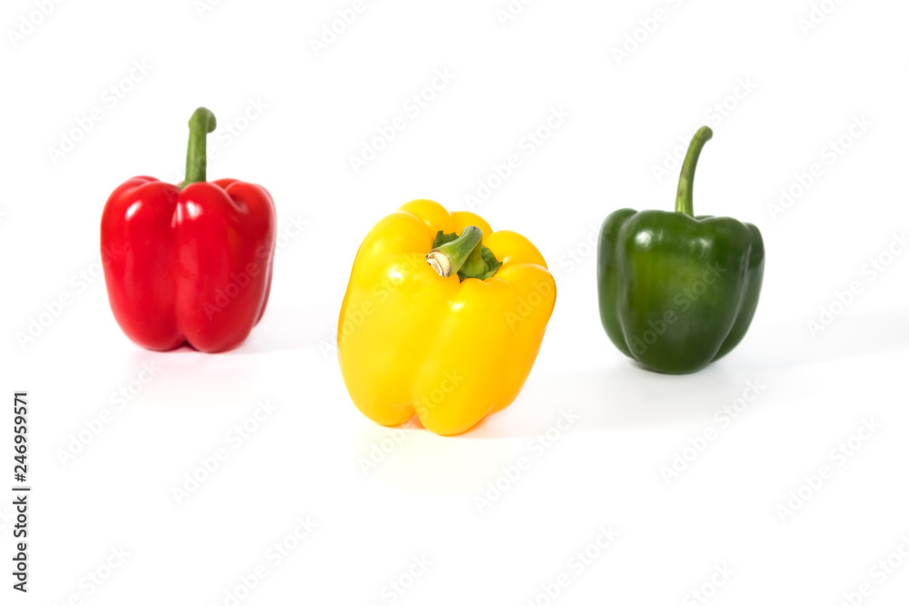 Red, yellow, green fresh and healthy peppers on white background Red, yellow, green fresh and healthy peppers on white background