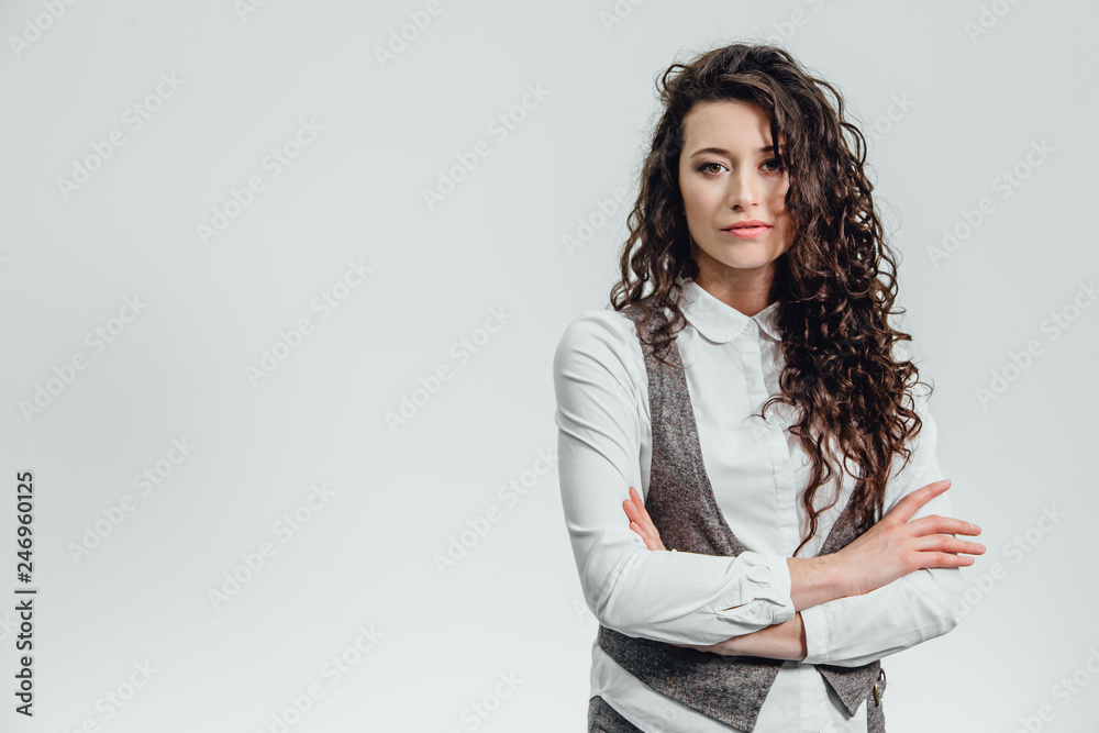 Portrait of an attractive business woman with her hand crossed a white background. Portrait of an attractive business woman with her hand crossed a white background.