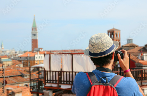 boy photographs the bell tower of San Marco in Venice