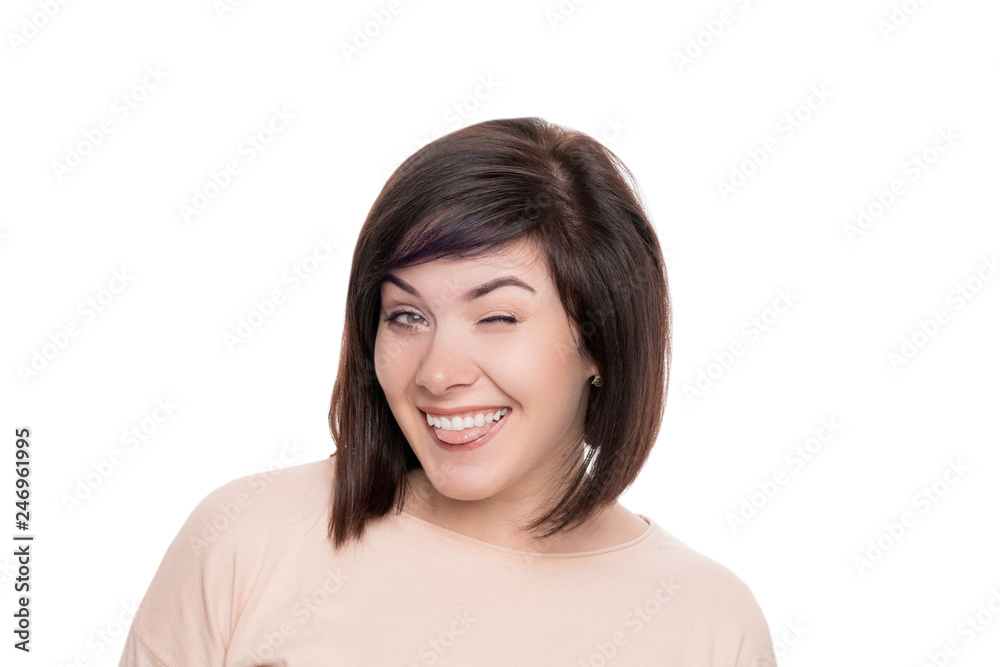 woman smiling and winking. cute brunette on white isolate background woman smiling and winking. cute brunette on white isolate background