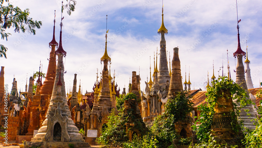 Hundreds of stupas or pagodas centuries old on the hills behind the village of Indein by lake Inle in Myanmaar 