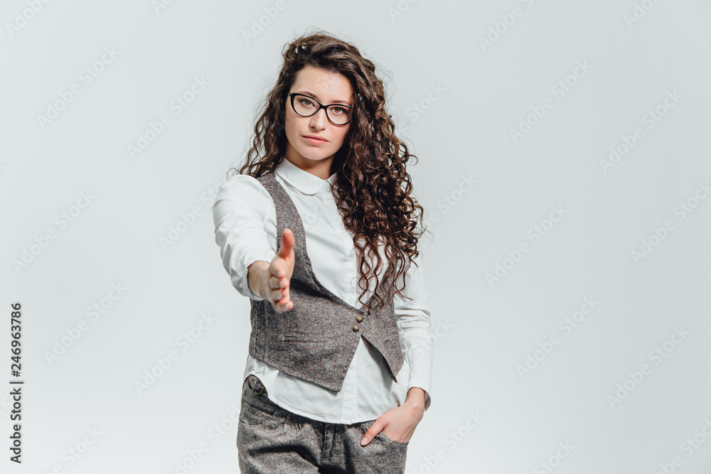 Funny portrait of an excited woman in glasses sunglasses. Close-up of a portrait of a young professional business woman makes the expression a funny face isolated on white background. Ready to Funny portrait of an excited woman in glasses sunglasses. Close-up of a portrait of a young professional business woman makes the expression a funny face isolated on white background. Ready to
