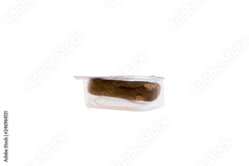 Stern velvet little mouse frozen in a package for feeding a snake. On a white background