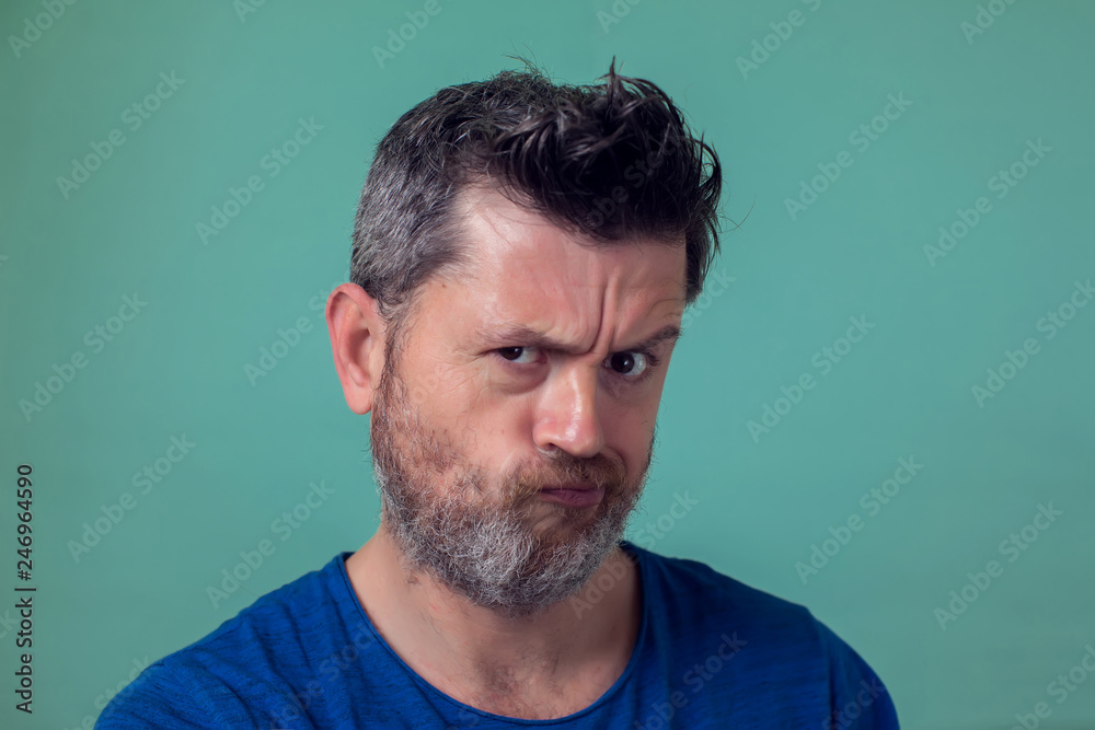Fototapeta premium People and emotions - angry man with beard