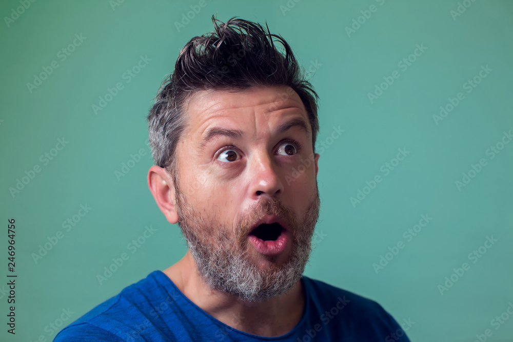 People and emotions - man surprised about something People and emotions - man surprised about something