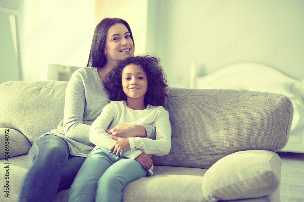 Proud mother and her adopted daughter having a lovely time together.