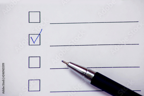 Checklist box with pen on white paper. Check form concept