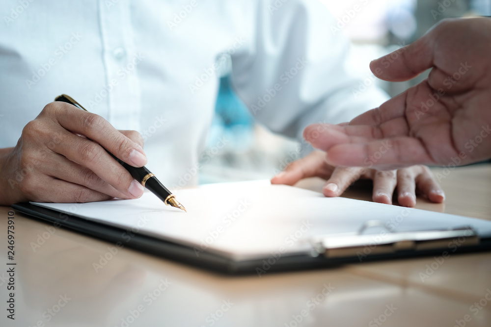Legal counsel presents to the client a signed contract with gavel and legal law. justice and lawyer concept. Legal counsel presents to the client a signed contract with gavel and legal law. justice and lawyer concept.