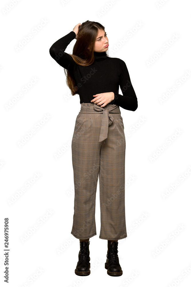 Full-length shot of Pretty girl having doubts while scratching head on isolated white background Full-length shot of Pretty girl having doubts while scratching head on isolated white background