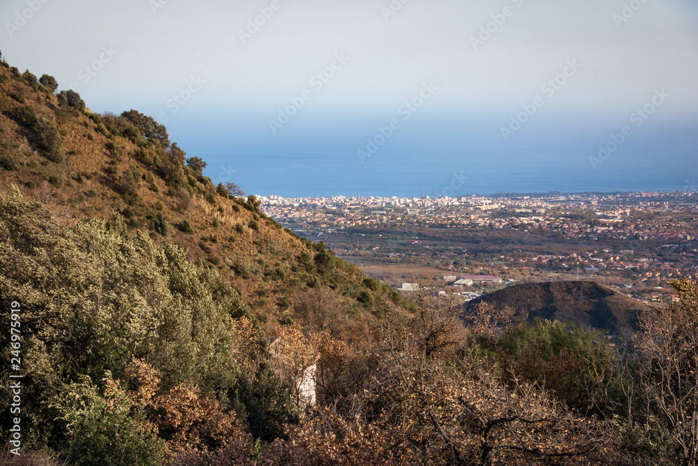 view of the valley at the foot of the Etna volcano, in the background the bay of Catania