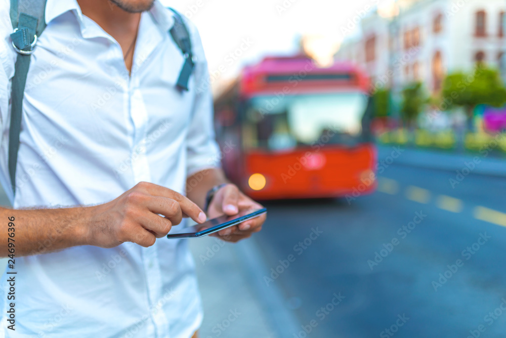 Man using navigation app on the smartphone on street