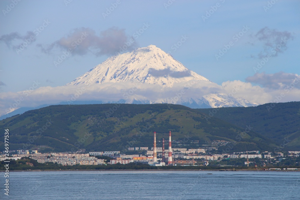 Koryaksky volcano towers over the city of Petropavlovsk-Kamchatsky. Koryaksky or Koryakskaya Sopka is an active volcano on the Kamchatka Peninsula in the Russian Far East.