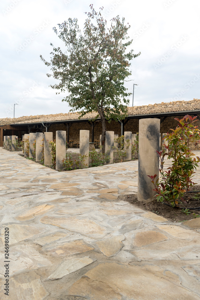 Garden of flowers, interesting concrete cylinders and shed.PLISKA, BULGARIA - 11.04.2017: Gates of the museum at the landmark Garden of flowers, interesting concrete cylinders and shed.PLISKA, BULGARIA - 11.04.2017: Gates of the museum at the landmark