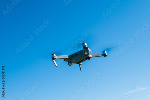 Fototapeta Naklejka Na Ścianę i Meble -  Folding drone flying in a sky