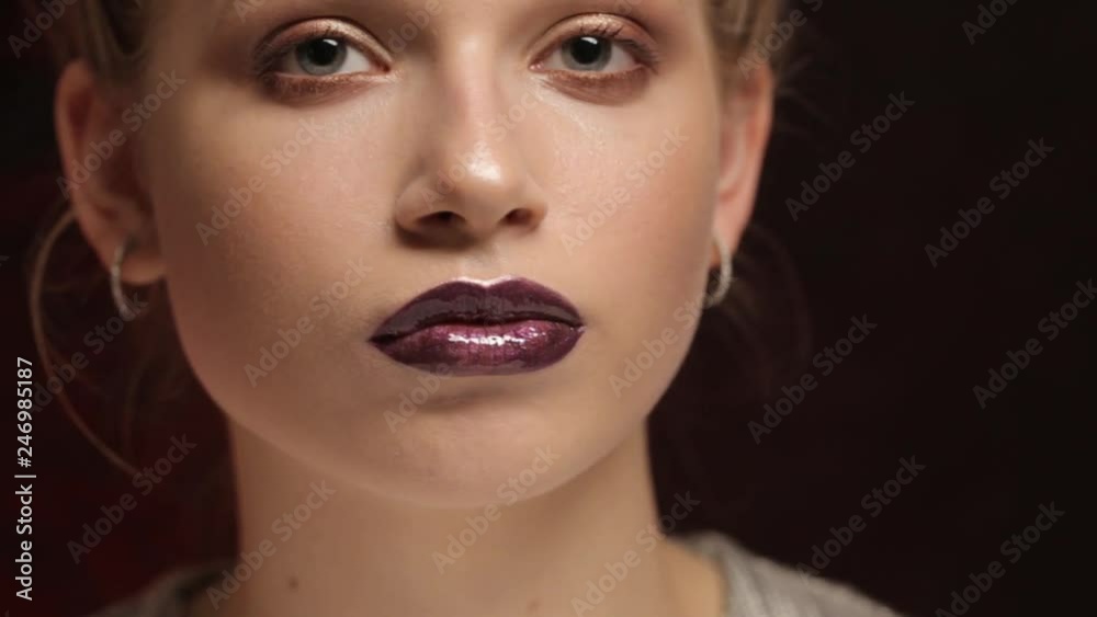 Portrait of a cute girl with professional make-up and beautiful lips close-up Portrait of a cute girl with professional make-up and beautiful lips close-up