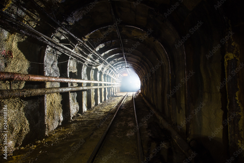 Underground gold ore emerald mine shaft tunnel gallery passage with light