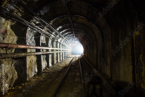 Underground gold ore emerald mine shaft tunnel gallery passage with light