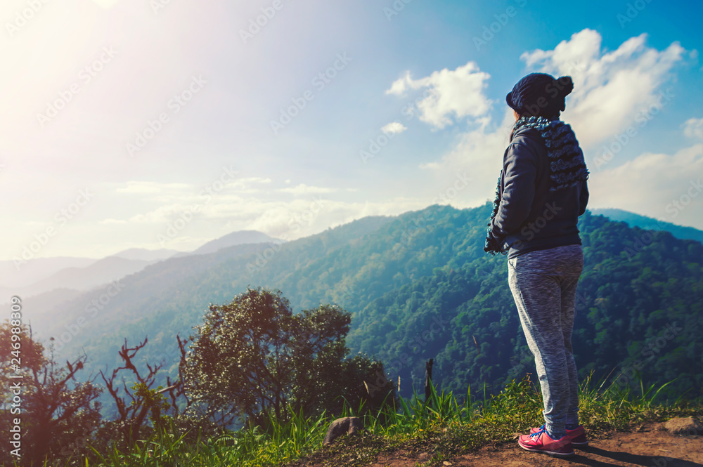 Young woman relaxing in natural park on the moutain. Young woman relaxing in natural park on the moutain.