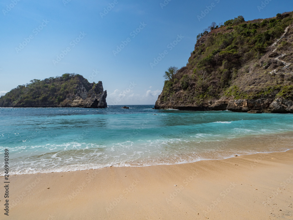 Big rocks in the ocean with white sand at Atuh beach on Nusa Penida island, Indonesia. November, 2018 Big rocks in the ocean with white sand at Atuh beach on Nusa Penida island, Indonesia. November, 2018