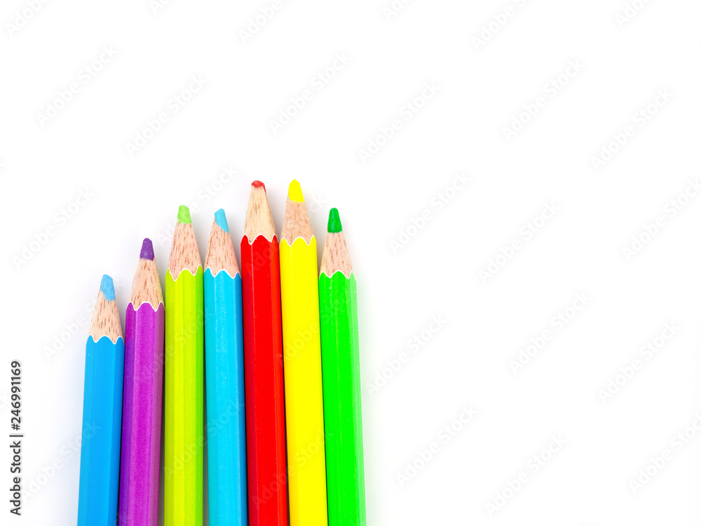 Fototapeta premium Multicolored pencils with free space for text on white background, Color pencils isolated