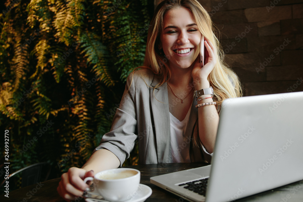 Young business woman working in cafe Young business woman working in cafe