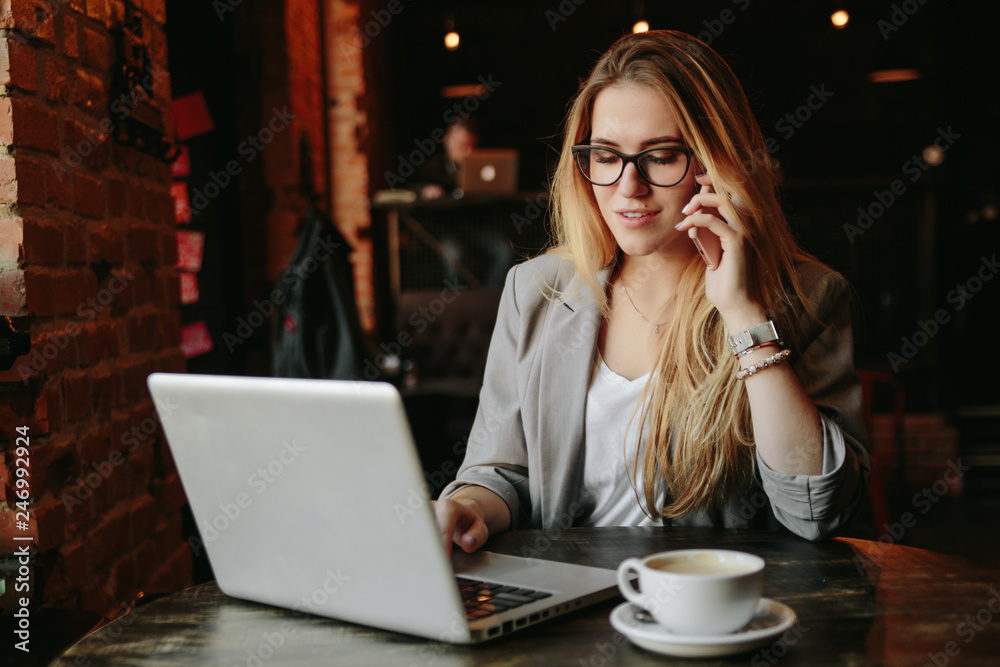 Young business woman working in cafe Young business woman working in cafe