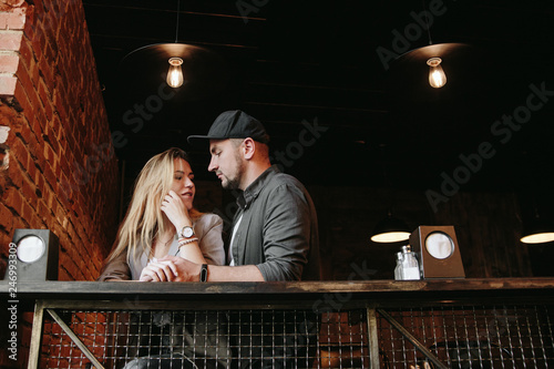 Young couple in loft cafe