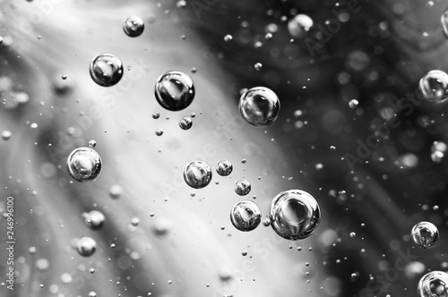Black and white photography. Oxygen bubbles in water on black white background. Macro