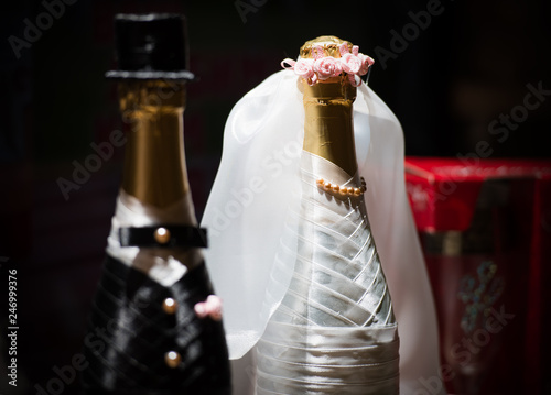 a bottle of champagne, decorated for the wedding.