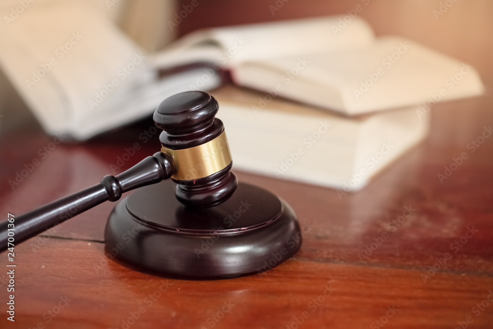 The judge gavel,Hammer of justice,Law concept,blurry light around The judge gavel,Hammer of justice,Law concept,blurry light around