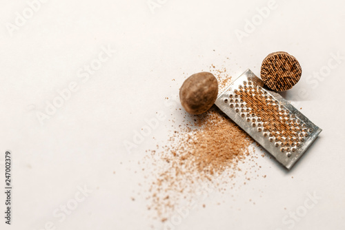 Nutmeg. Whole nut, half and powder isolated on white background.