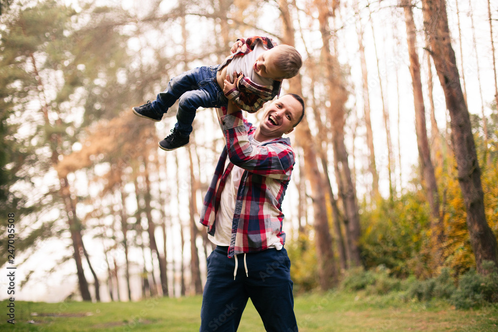 Fototapeta premium Father and son together in forest