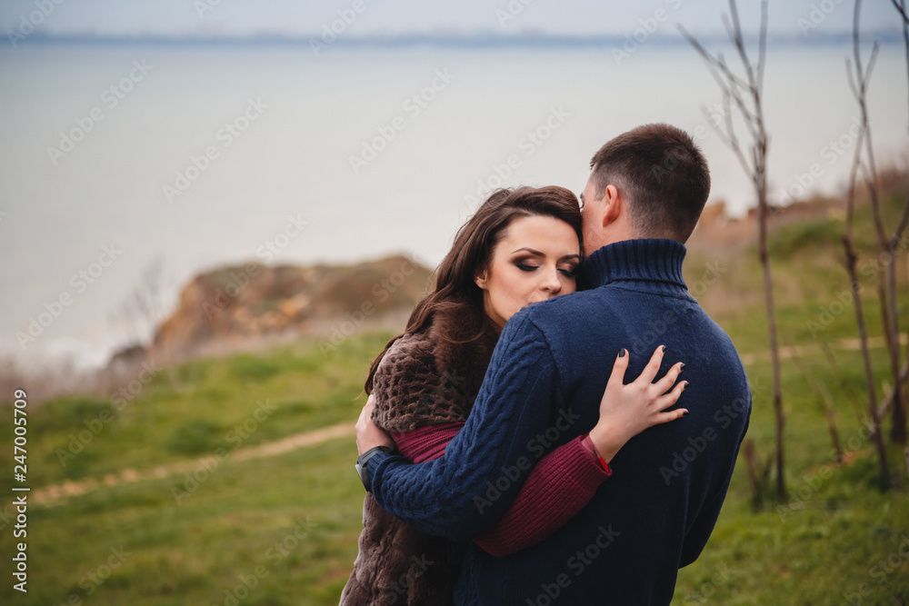 Close up of romantic attractive young couple hugging Close up of romantic attractive young couple hugging