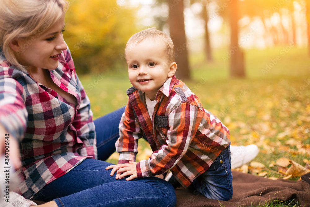 Family on weekend. Mother father and son in park Family on weekend. Mother father and son in park