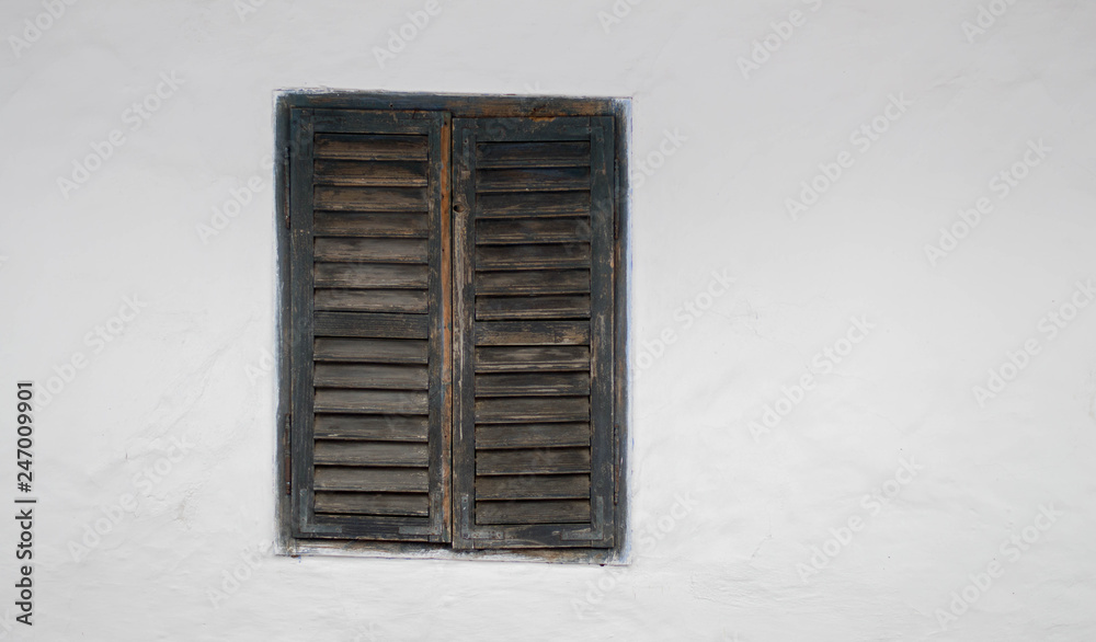Fototapeta premium Rustic old peasant house with wooden windows
