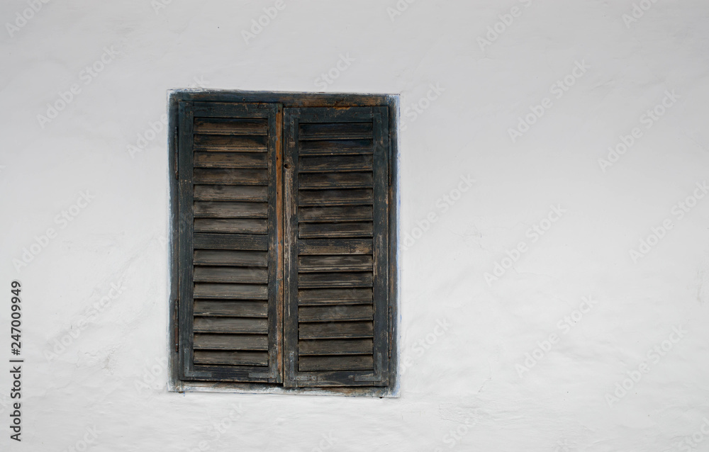 Fototapeta premium Rustic old peasant house with wooden windows