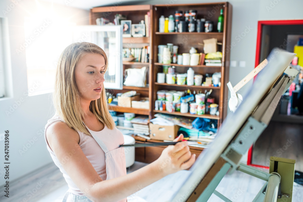 Creative woman working in art studio Creative woman working in art studio