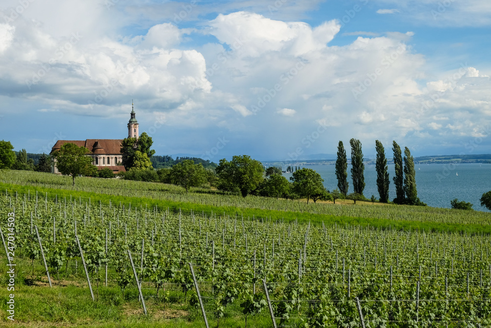 a church with a view of the lake constance