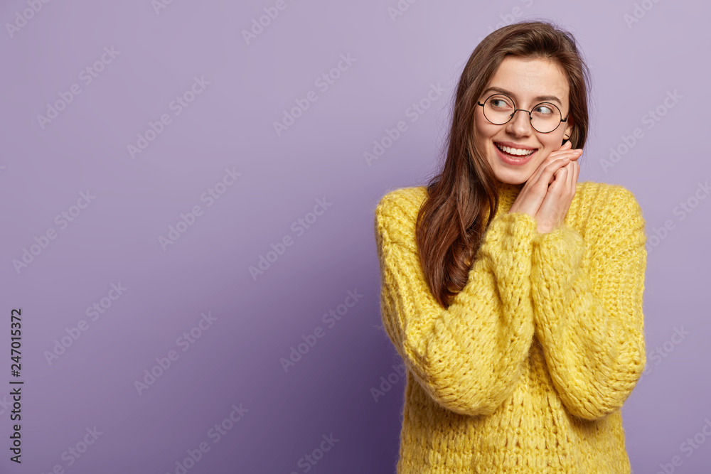 Satisfied Cheerful Woman Has Toothy Smile Shows White Teeth Keeps Hands Near Face Dressed In