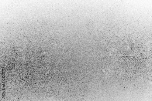 The texture of misted glass. Drops on the glass. Black and white picture © Gartforu